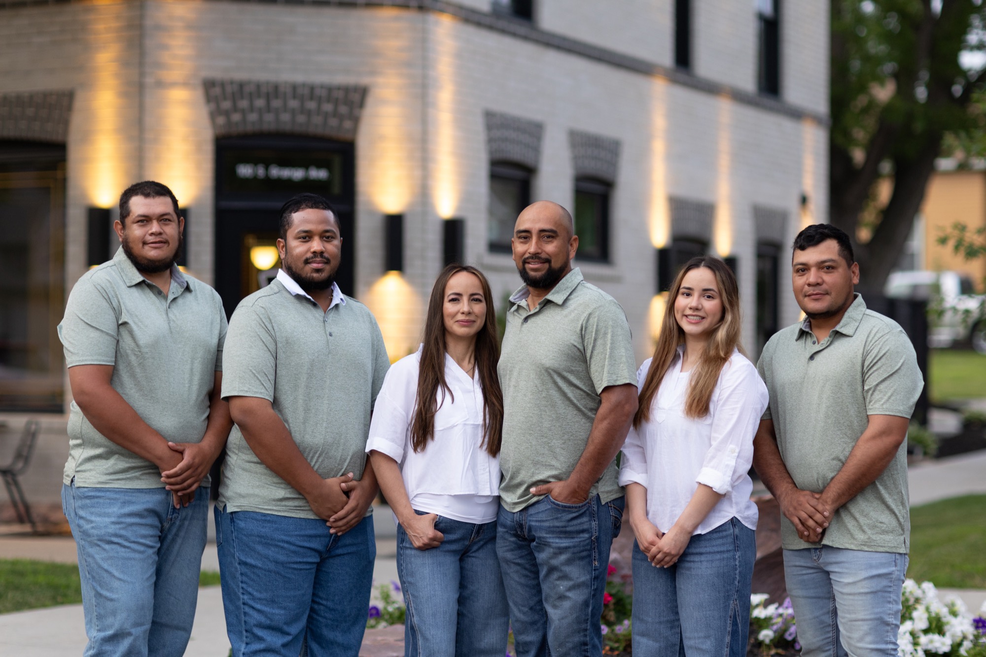 The RJ Contracting team together in downtown Sioux Falls at dusk